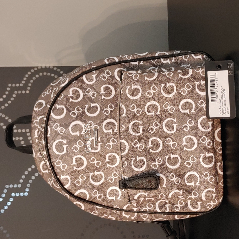 Nice Guess snake print backpack.